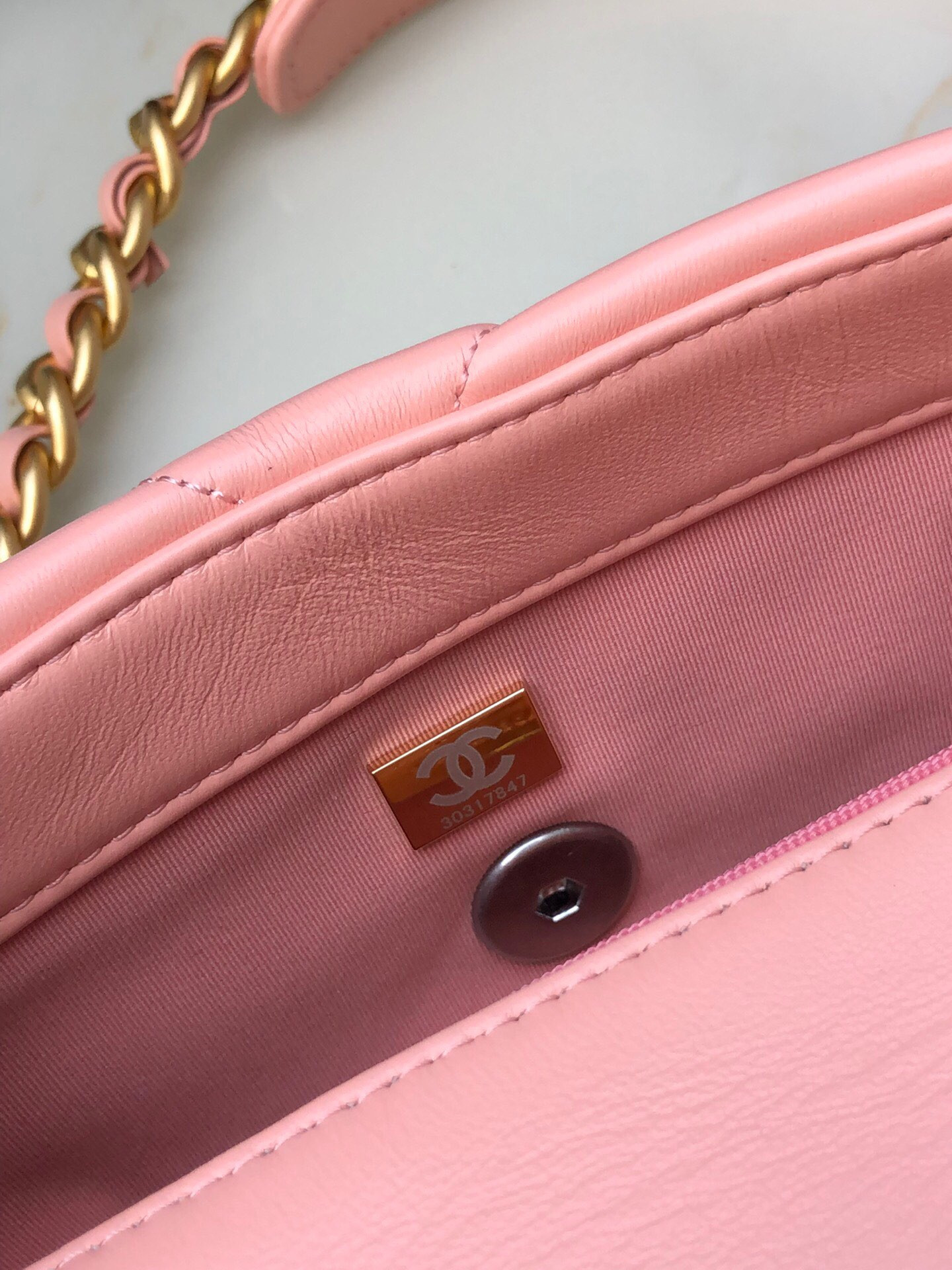 CHANEL 19 HANDBAG Shiny Leather, Gold-Tone, Silver-Tone & Ruthenium-Finish Metal Light Pink 6.2 × 10.1 × 3.5 in